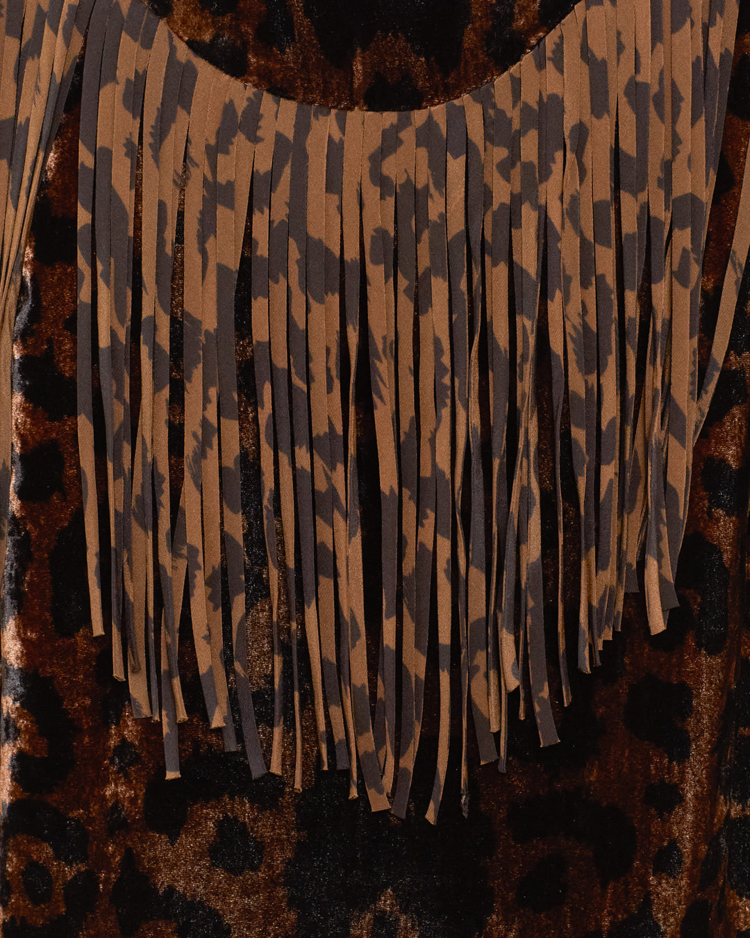 Close-up of the Jude Leopard Velvet Jacket, a Western-inspired piece with luxurious silk fringe details hanging from the neckline and a bold leopard-print velvet finish.