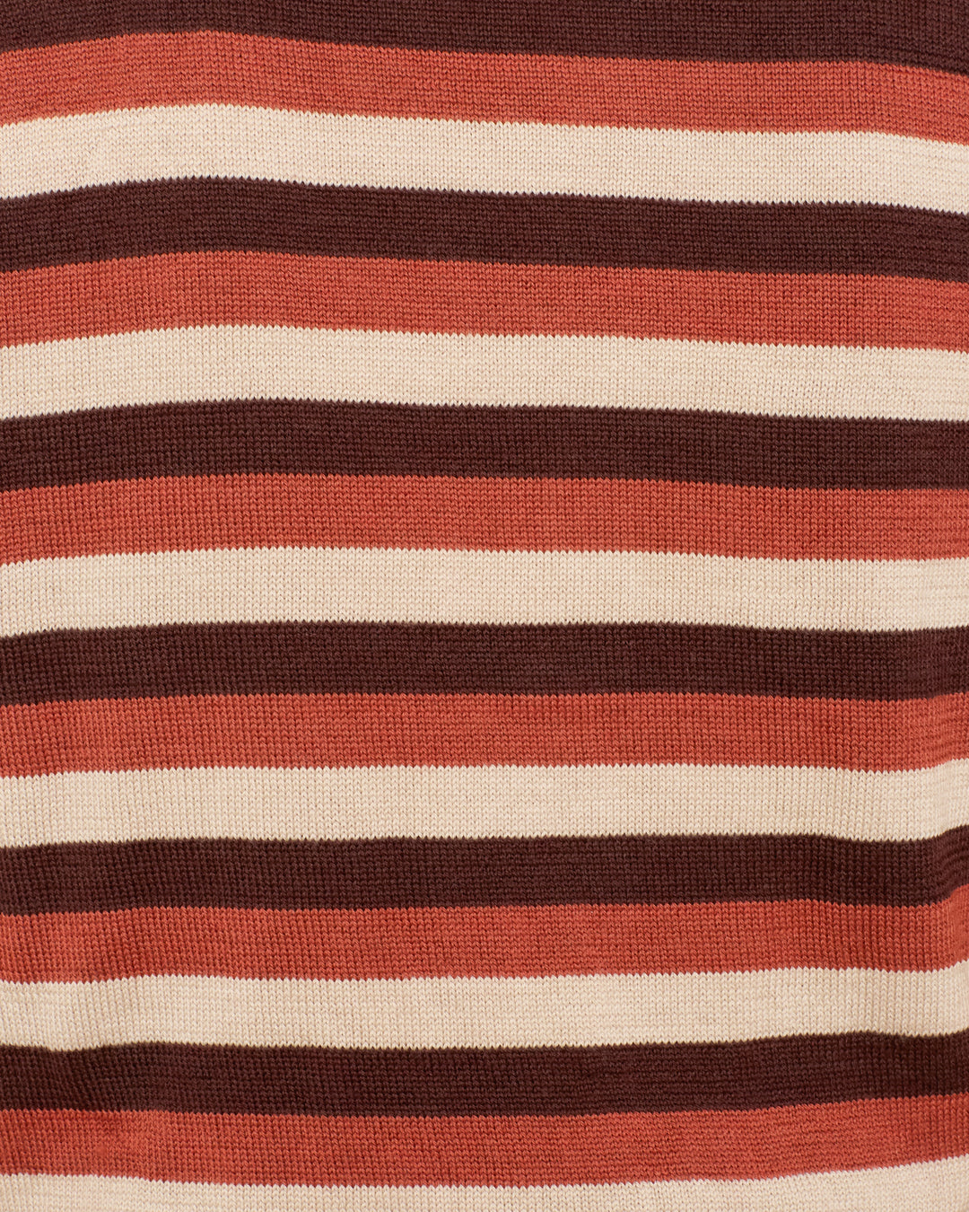 Close-up of the Lessi Sandstone Stripe Top, featuring soft knit material and horizontal stripes in brown, beige, and rust tones. The texture of the sweater is clearly visible.