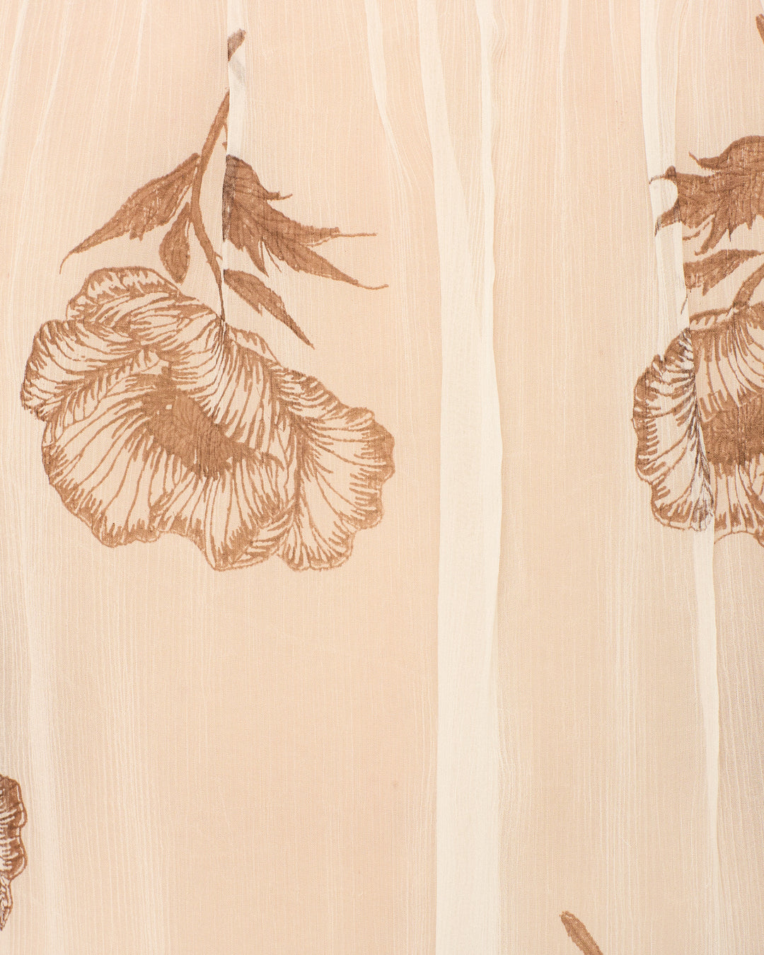 The Pascal Obsidian Poppy Top features beige semi-sheer fabric with vertical stripes and bold brown floral prints—ideal for chic, hand-block-printed cupro-chiffon designs.