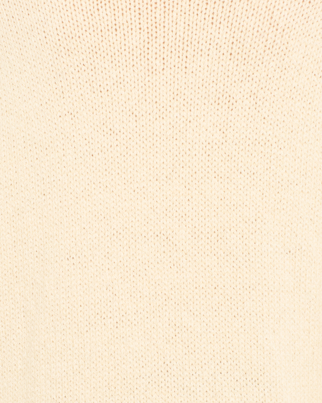 Close-up of beige knit fabric with a regular, textured stitch pattern—ideal for the Rosa Lovebird Knit Sweater, a cozy and stylish winter layer.
