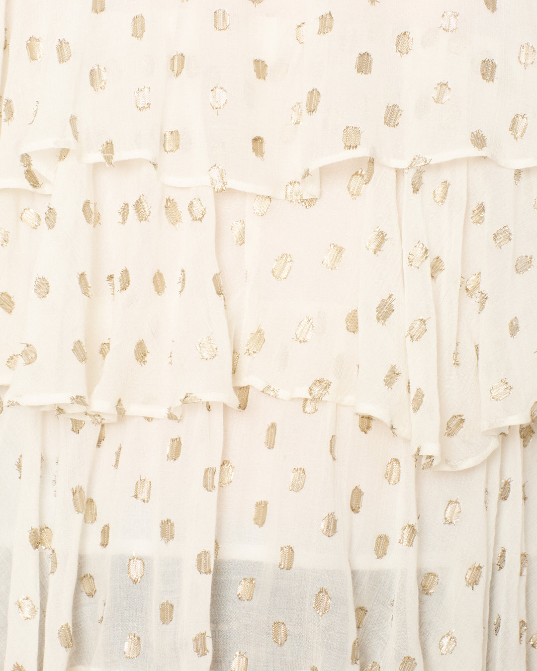 Close-up of the Rufus Bronze Mist Top: a layered white blouse with sheer, lightweight fabric, featuring irregular gold dots for a delicate, airy look.