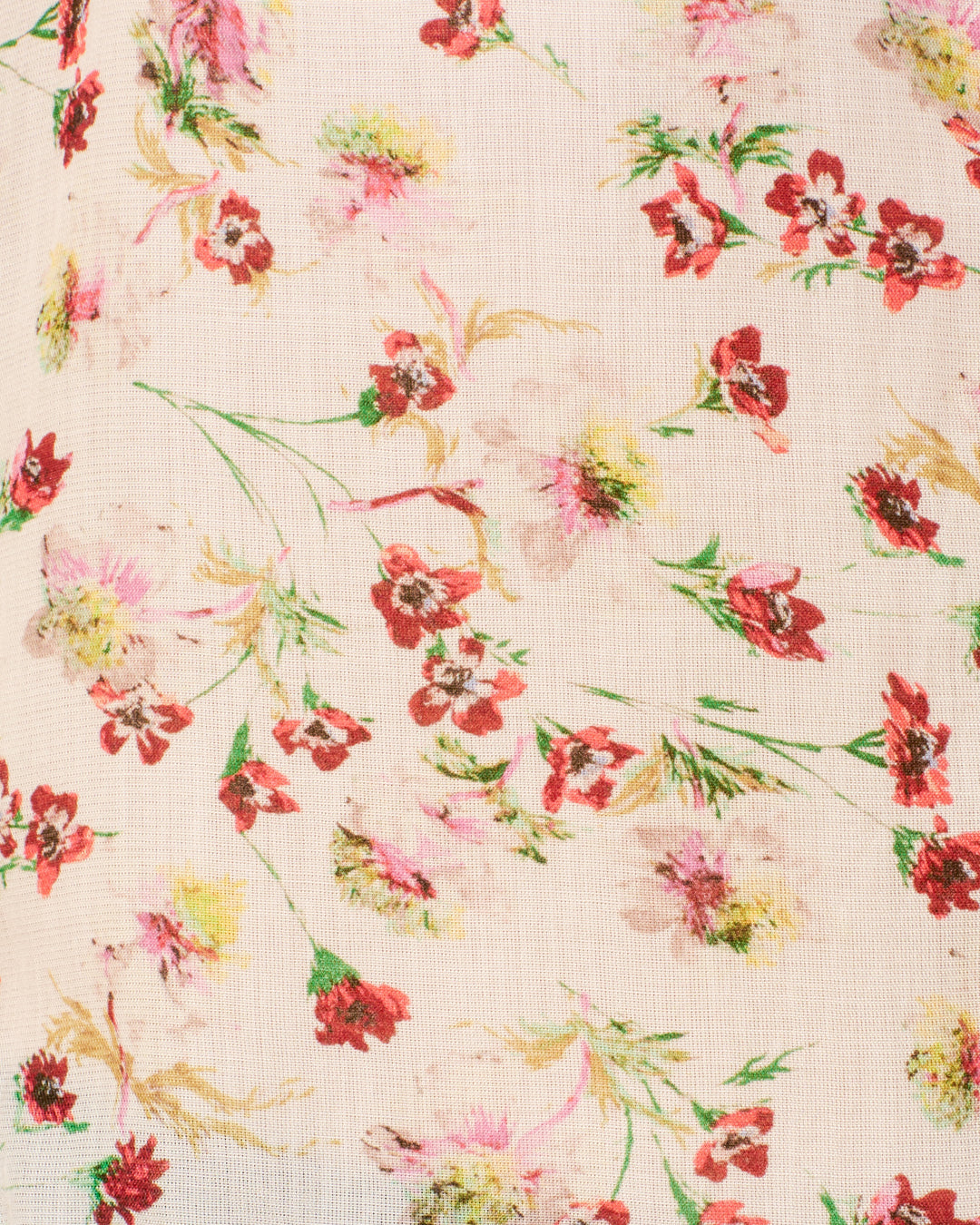 A close-up of the Chance Wild Garden Shirt's silky modal fabric, set on a light beige background with a floral pattern featuring small red, pink, and yellow flowers alongside green stems and leaves.