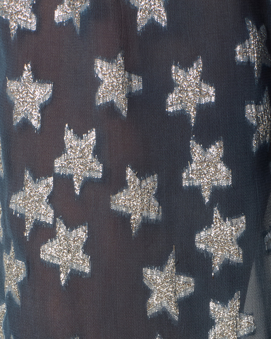 Close-up of the Margot Starlite Pant’s viscose-chiffon fabric, featuring embroidered metallic silver stars in neat rows.