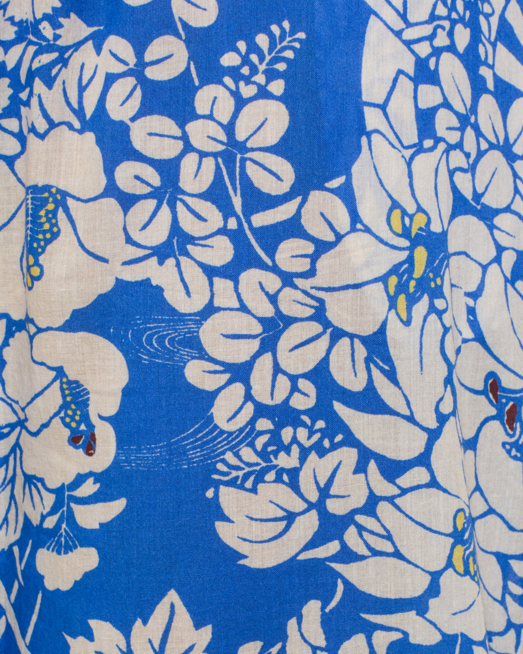 The Otto Royal Spoke Pant features blue fabric with a white and yellow hanaguruma motif—large, stylized flowers and leaves in a repeating design—ideal for a relaxed, pajama-style cotton voile silhouette.