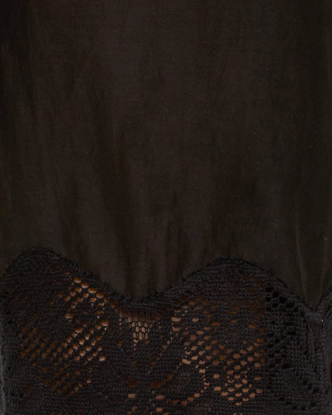 A close-up of the Tillie Onyx Prima Lace Short showcases black fabric with a floral-patterned cotton lace trim at the hem.