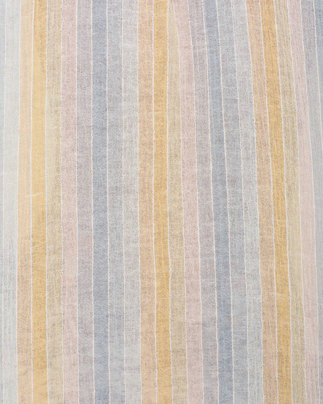 The Winnie Sunwash Stripe Shirt features vertical pastel stripes in soft blue, yellow, pink, and beige on a textured gauzy cotton fabric.